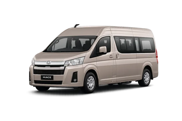 Toyota Hiace Premio coklat muda metallic tampak serong depan dan samping untuk layanan sewa Hiace Bandung dengan driver profesional