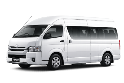 Toyota Hiace Commuter Luxury putih tampak serong depan dan samping untuk layanan sewa Hiace Luxury Bandung dengan driver profesional